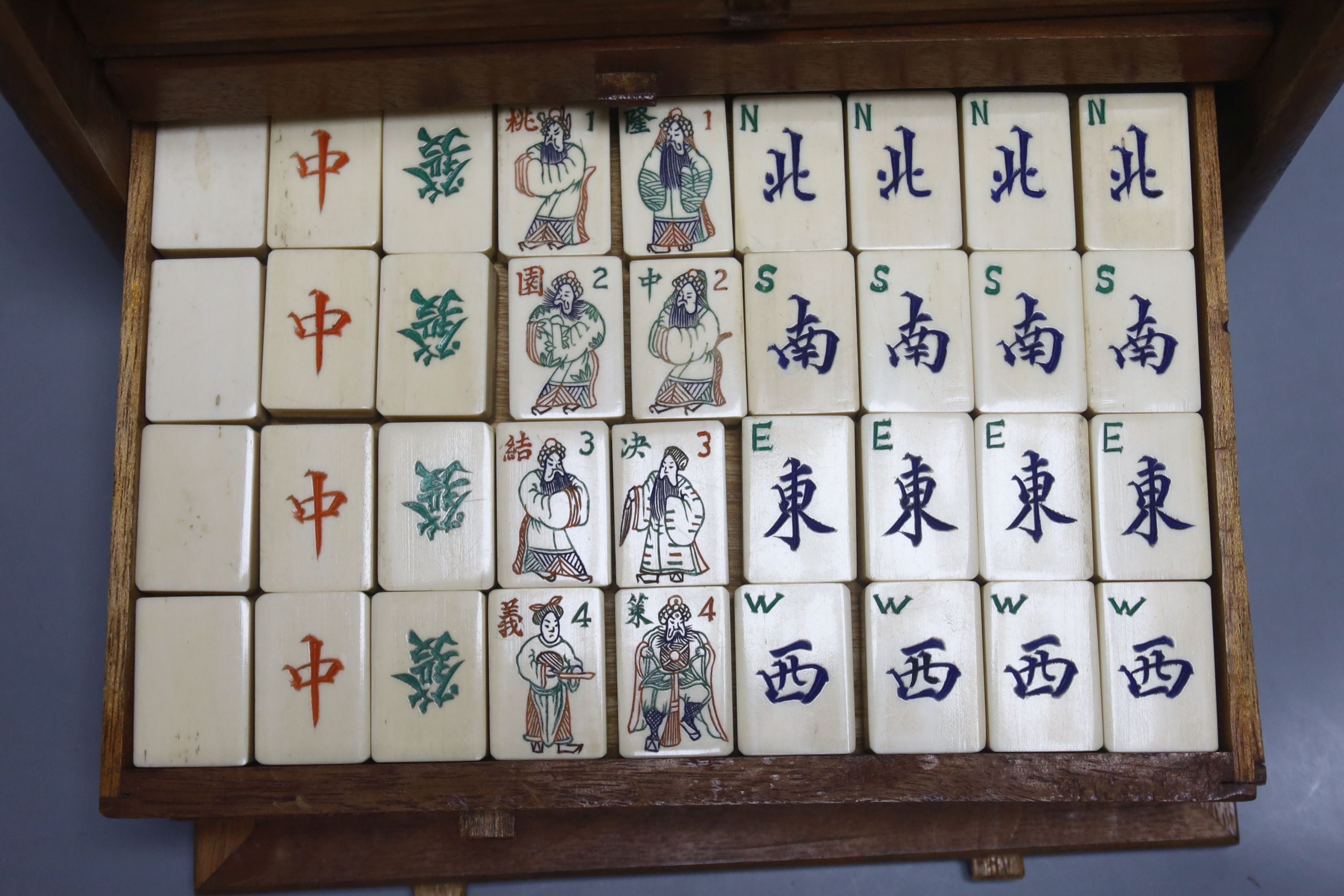 A Chinese hardwood cased mah jong set
